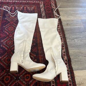 Knee high white high heel boots